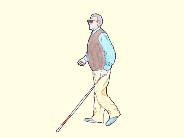 Niewidomy mężczyzna idzie z białą laską