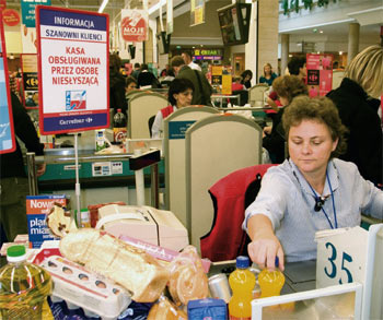 a person with hearing impairment working at the supermarket